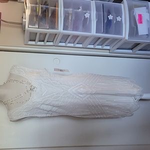 Beaded short tankwith scaleped  hem